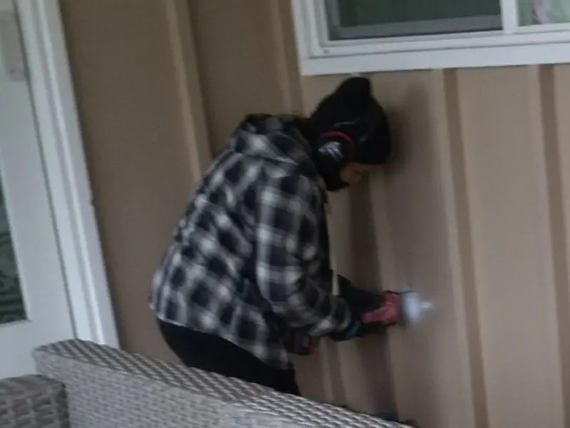 Professional electrician installing an exterior outlet in Little Canada