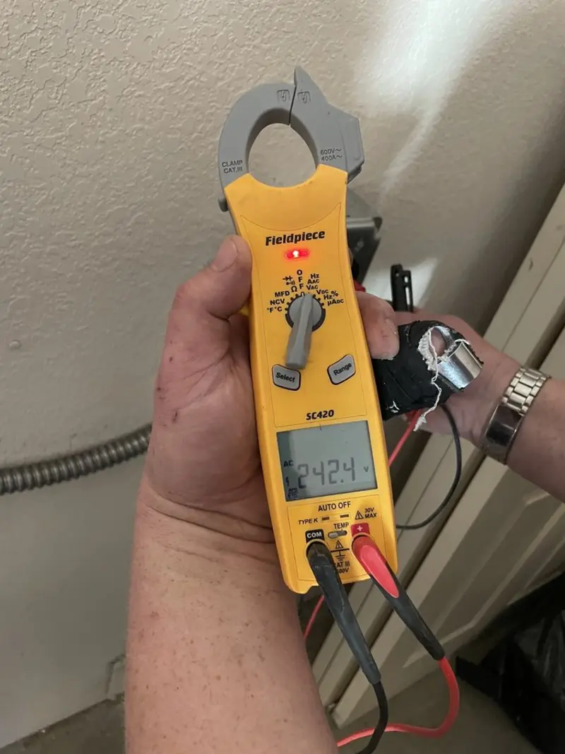 Voltage testing with clamp meter during Generator Installation in Little Canada